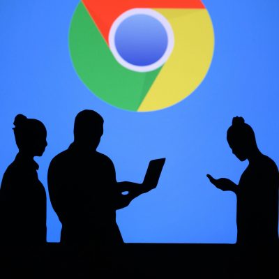 NEW YORK, USA, 25. MAY 2020: Google Chrome web browser developed by Google Group of business people chat on mobile phone and laptop. Company logo on screen in background
